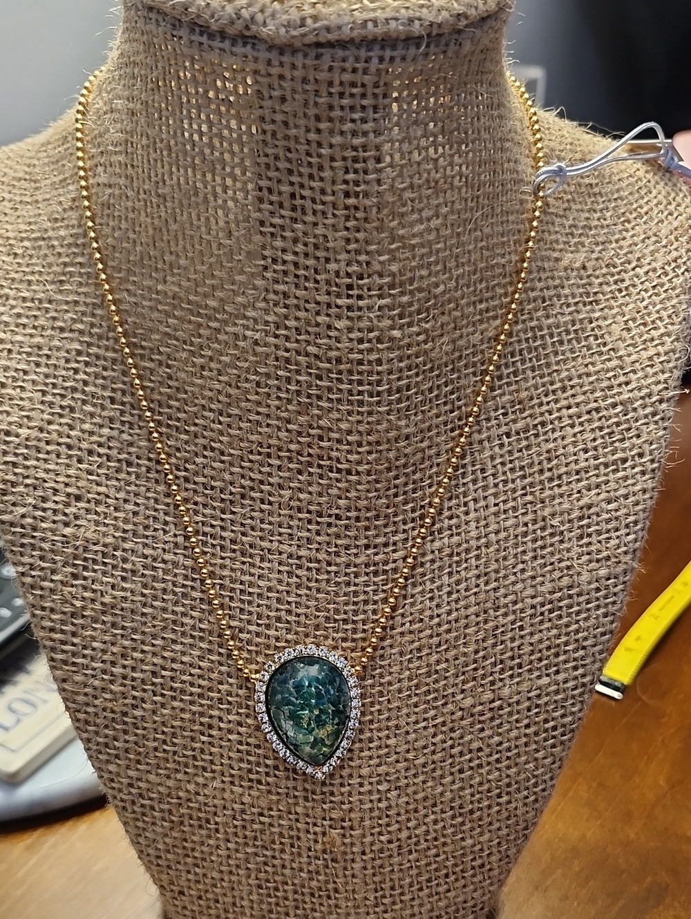 Gold-Tone Teardrop Necklace with Emerald-Green Stone and Crystal Halo